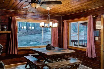 a dining room with a table and a window at 74 Our Yosemite Getaway in Wawona