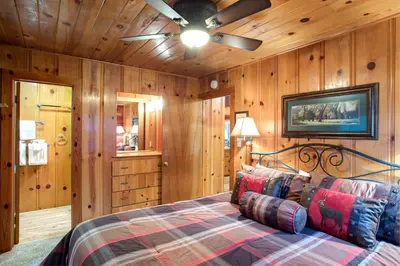 a bedroom with a bed and a ceiling fan at 74 Our Yosemite Getaway in Wawona