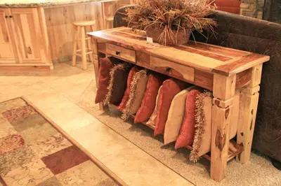 a wooden table with pillows on a couch at 66 Grizzly Giant in Wawona