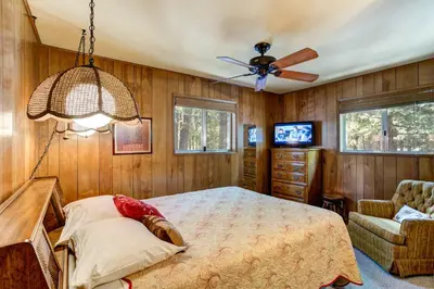 a bedroom with a bed and a ceiling fan at 4B Mountain Memory in Wawona