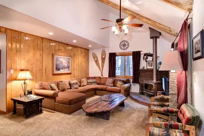a living room with a couch and a table at 2N Big Pine Lodge in Wawona