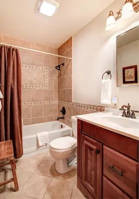 a bathroom with a sink and a toilet and a tub at 2N Big Pine Lodge in Wawona