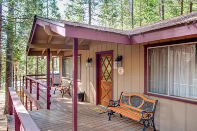 a porch of a house with a bench on it at 20B We-Dunn-It in Wawona