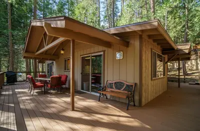 a small house with a roof on a deck at 20B We-Dunn-It in Wawona