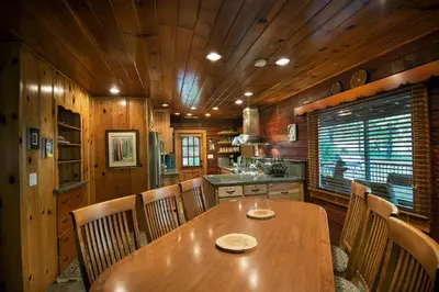 a dining room with a wooden table and chairs at 48 Sugar Pine Suite in North Wawona