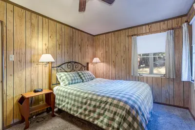 a bedroom with a bed and a window at 81 Ashbaugh Meadow in North Wawona