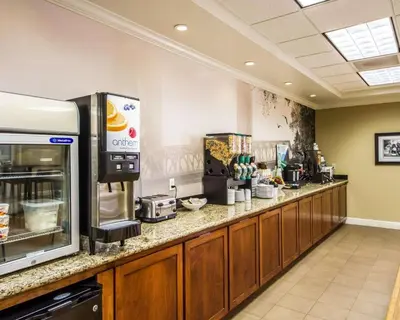 a kitchen with a counter with aasteryasteryasteryasteryasteryasteryasteryasteryastery at Hotel Med Park, an Ascend Collection Hotel in Sacramento