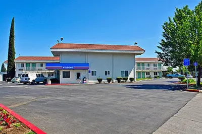 a parking lot in front of a building at Motel 6-Sacramento, CA - North in Sacramento