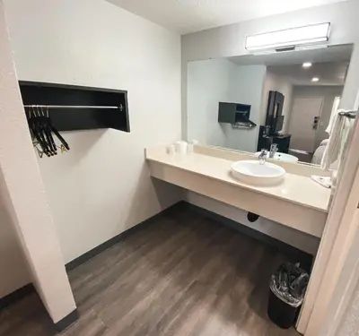 a bathroom with a sink and a mirror at Motel 6-Sacramento, CA - North in Sacramento