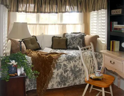 a living room with a couch and a chair at Cottage on Armstrong in Lodi