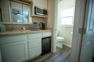 a bathroom with a sink and a toilet at Cottage on Armstrong in Lodi