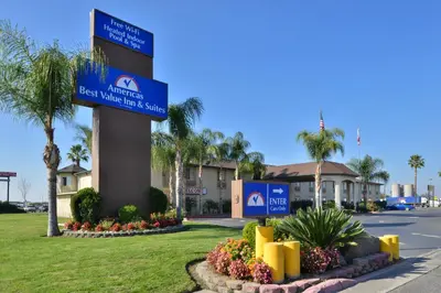 a sign for the best walmart next to a street at Americas Best Value Inn & Suites Madera in Madera