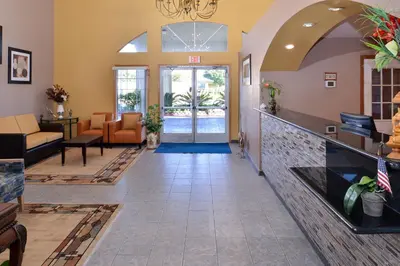 a lobby of a hotel with an entry way at Americas Best Value Inn & Suites Madera in Madera