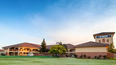 a rendering of the front of a building at Motel 6-Santa Nella, CA - Los Banos in Santa Nella Village