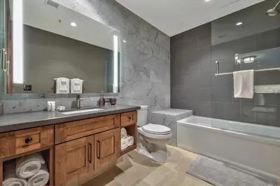 a bathroom with a sink and a tub and a toilet at Zalanta, A Vail Resorts Property in South Lake Tahoe
