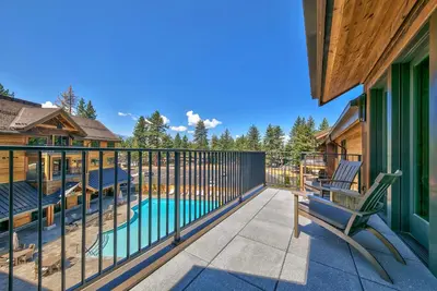 a balcony with a bench and a swimming pool at Zalanta, A Vail Resorts Property in South Lake Tahoe