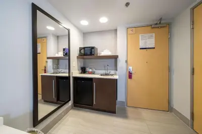 a kitchen with a mirror and a sink and a door at Hampton Inn & Suites Modesto - Salida in Modesto