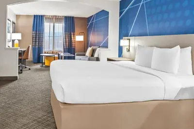 a large white bed in a hotel room at Comfort Inn South San Jose - Morgan Hill in Morgan Hill
