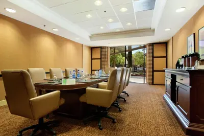 a conference room with a long table and chairs at Hilton Stockton in Stockton