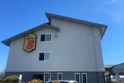 a sign on the side of a restaurant at Super 8 by Wyndham Sacramento/Florin Rd in Sacramento