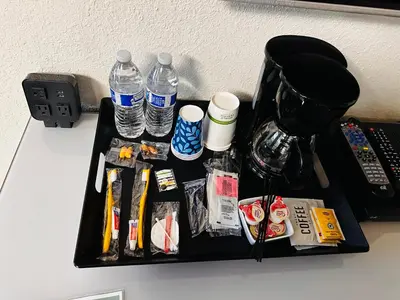 a black tray with bottles of water on a table at Sierra Inn in San Andreas