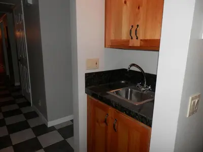a kitchen with a sink and a black counter top at Rr-interlaken 05 in June Lake