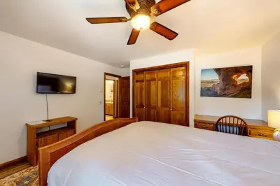 a bedroom with a bed and a ceiling fan at Mammoth Pines 11 in Mammoth Lakes