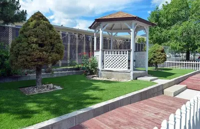 a gazebo in a yard with a green lawn at Americas Best Value Inn - Carson City in Carson City