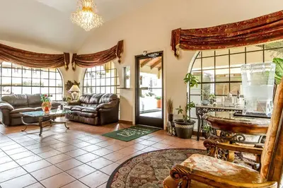 a living room with a couch and a table at Quality Inn & Suites Gilroy in Gilroy