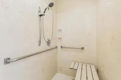 a bathroom with a toilet and a shower at Baymont by Wyndham Modesto Salida in Modesto