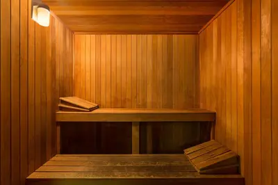 a sauna with wooden walls and a wooden shelf at Baymont by Wyndham Modesto Salida in Modesto