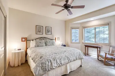 a bedroom with a bed and a ceiling fan at Alderhill in Shaver Lake