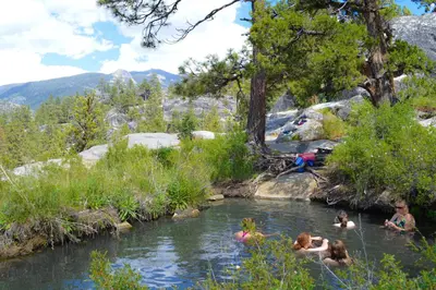 a group of people swimming in a river at Eagle's Landing Condo 78 in Lakeshore