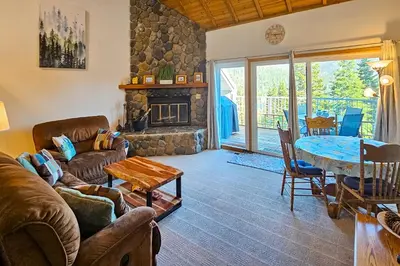 a living room with a couch and a table at Eagle's Landing Condo 78 in Lakeshore