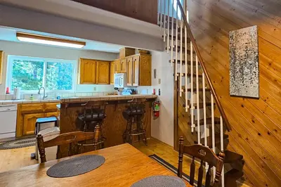 a kitchen with a table and a counter top at Eagle's Landing Condo 78 in Lakeshore