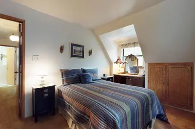 a bedroom with a bed and a sink in it at Foxtail Delight in Dora Belle