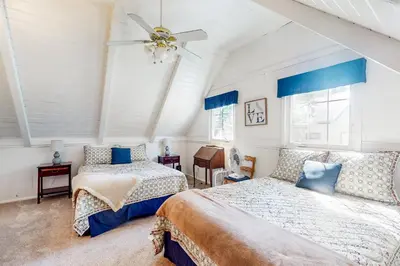a bedroom with two beds and a ceiling fan at Mountain Memories in Shaver Lake