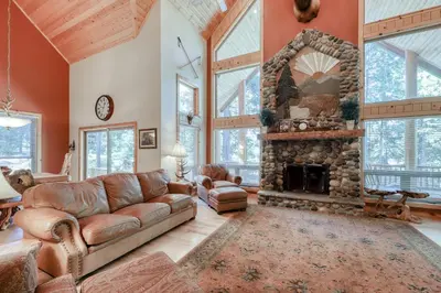 a living room with a couch and a fireplace at Pinnacle Point in Shaver Lake