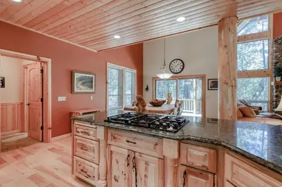 a kitchen with a stove top oven in a room at Pinnacle Point in Shaver Lake