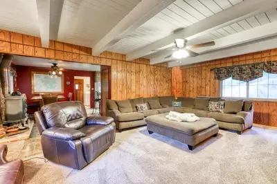 a living room with leather furniture and a tv at The Limit in Dora Belle