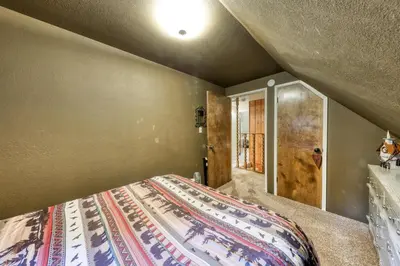 a bedroom with a bed in a room at The Limit in Dora Belle