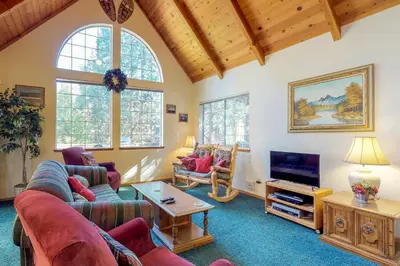 a living room with a couch and a tv at Travelers Rest in Shaver Lake Heights