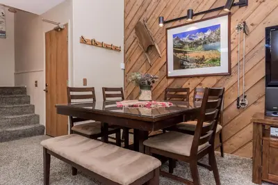 a dining room with a table and chairs at Crestview -B # 46 in Mammoth Lakes