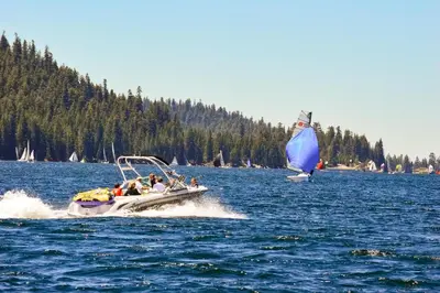 a group of people on a boat in the water at Huntington Lake Condo 115 in Lakeshore