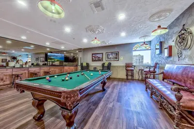 a billiard room with a pool table and a bar at Plaza Resort Club Reno in Reno