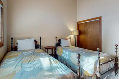 two beds sitting next to each other in a room at Tahoe City Retreat in Lake Forest