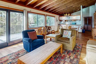 a living room with two chairs and a table at Tahoe City Retreat in Lake Forest