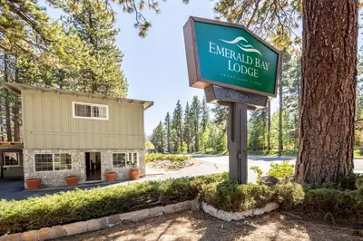 a sign for emerald day lodge in front of a building at Emerald Bay Lodge in South Lake Tahoe