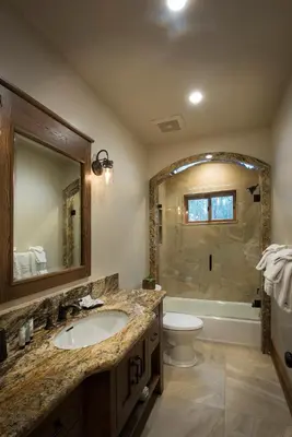 a bathroom with a sink and a toilet and a shower at 1R Rustic Retreat in Wawona