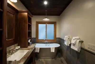 a large bathroom with a tub and a window at 1R Rustic Retreat in Wawona